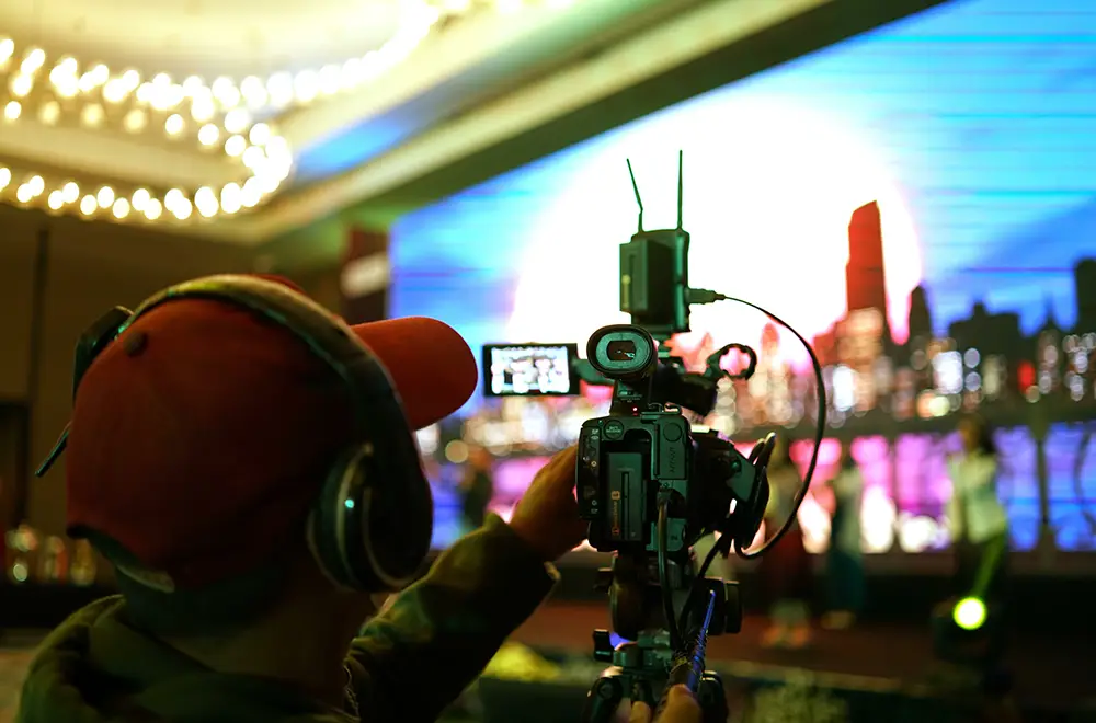 corporate-events a cameraman filming a corporate event